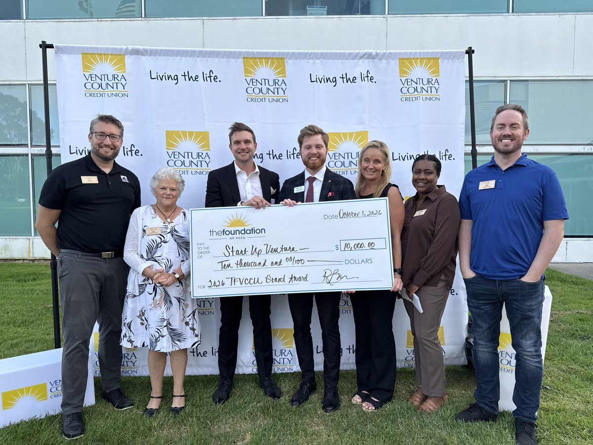 Luke Erickson accepting a $10,000 grant check for Startup Ventura from The Foundation of VCCU